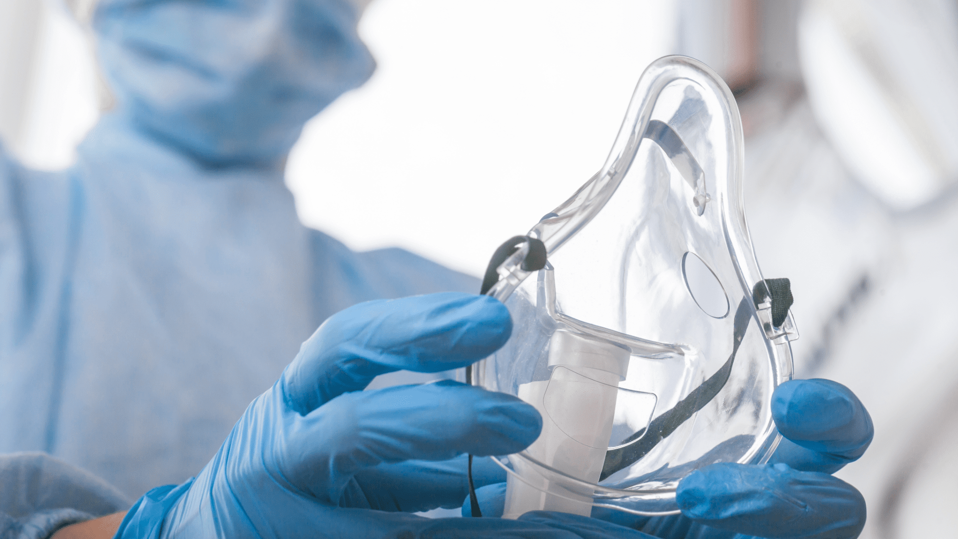 Medical Professional Holding Oxygen Mask